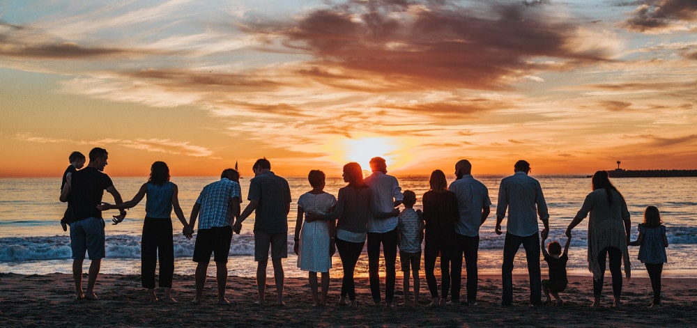 Image of family watching sunset protected with heathcare.